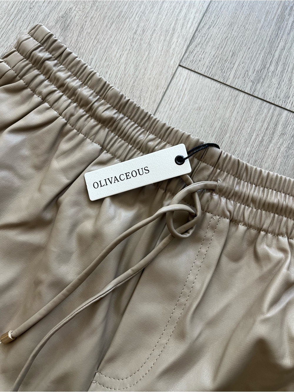 Olivaceous Faux Leather Joggers in Taupe and Cream